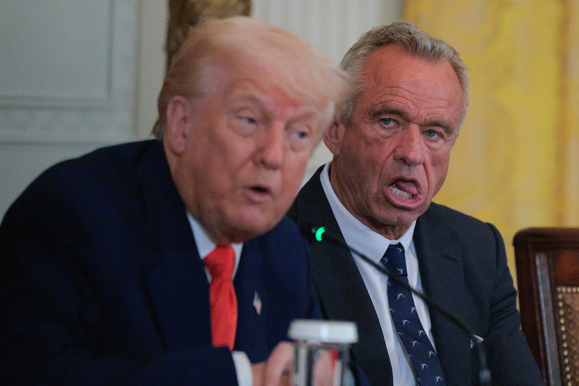 President Donald Trump and Health and Human Services Secretary Robert F. Kennedy Jr. attend an event introducing a new Make America Healthy Again Commission report in the East Room of the White House on May 22, 2025 in Washington, DC.